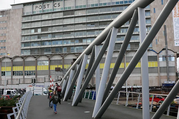 2006.10 - 'Modern bridge architecture' - Amsterdam photos and pictures - a view over a bridge for cyclists and pedestrians, in the Oosterdok waterfront; urban Dutch photography in public domain; Dutch city + geotag, Fons Heijnsbroek, The Netherlands