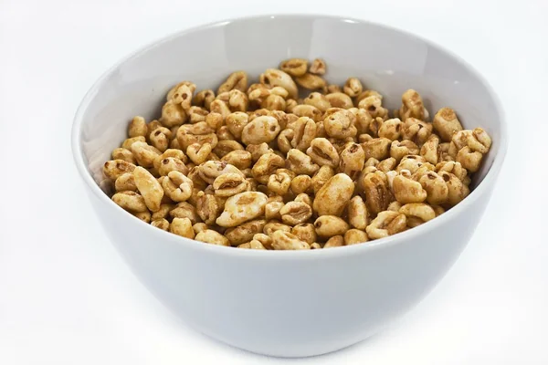 Light gray ceramic bowl of honey cereals