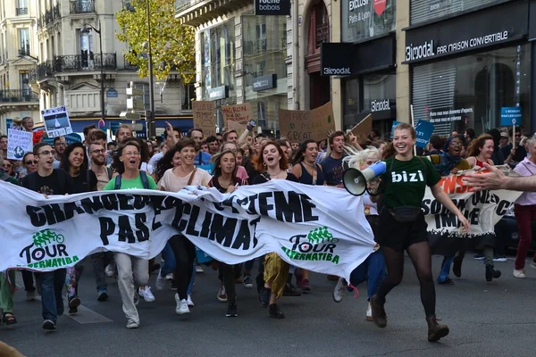 Climate change protesters march in Paris streets
