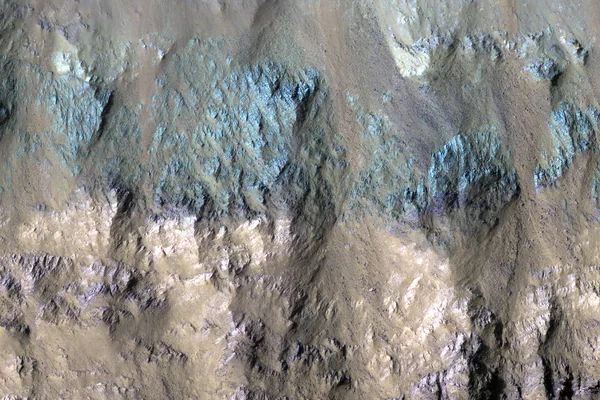 Varied Types of Rock in a Crater in Eos Chasma