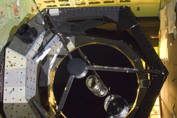he SOFIA airborne observatory's 2.5-meter infrared telescope peers out from its cavity in the SOFIA rear fuselage during nighttime line operations testing