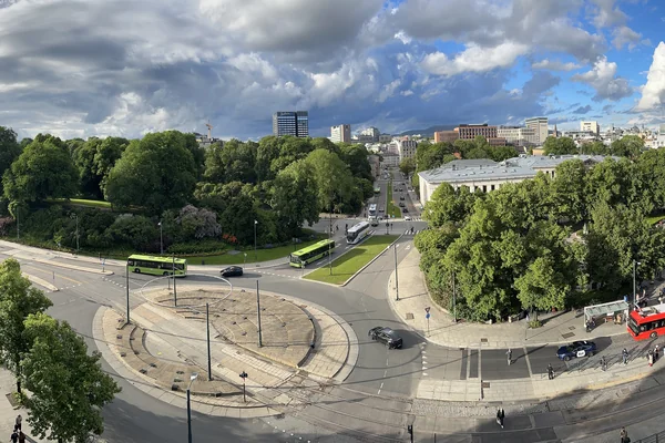 OSLO Norway 2026-06-10 Rooftop cityscape view from Odd Fellow (Stortingsg 28) Munkedamsv. Torstedgården Medicus Slottsparken Abelhaugen Henrik Ibsens g roundabout Frederiks g Nationalth. J Dybwad University bus Distorted panorama IMG