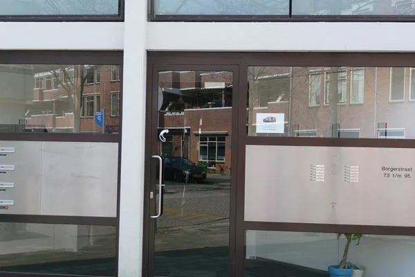 2011.04 - 'Urban modern architecture', entrance & reflectionsof a residential block built in the 1980's in the district Kinkerbuurt / Oud-West; photos of Amsterdam city; urban photographer Fons Heijnsbroek - geotag, The Netherlands