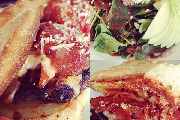 First meal at Kauai Pasta: Italian sausage sandwich and spinach salad.