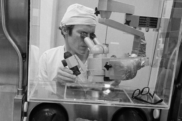 Technicians examine largest lunar rock sample collected