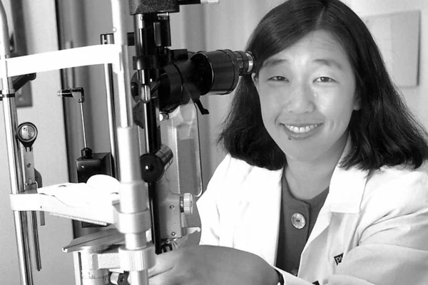 Doctor with microscope, 1999