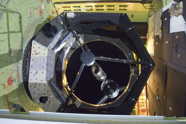 The 2.5-meter infrared telescope peers out from its cavity in the SOFIA airborne observatory during nighttime line operations testing at Palmdale, Calif.