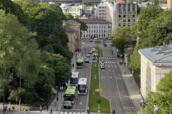 OSLO Norway 2026-06-10 Rooftop cityscape view towards north from Odd Fellow-bygn. (Stortingsg 28) FREDERIKS GATE crossing Karl Johans gate Slottsparken Royal Palace Park Universitetet Traffic buses people pedestrians etc IMG 6919