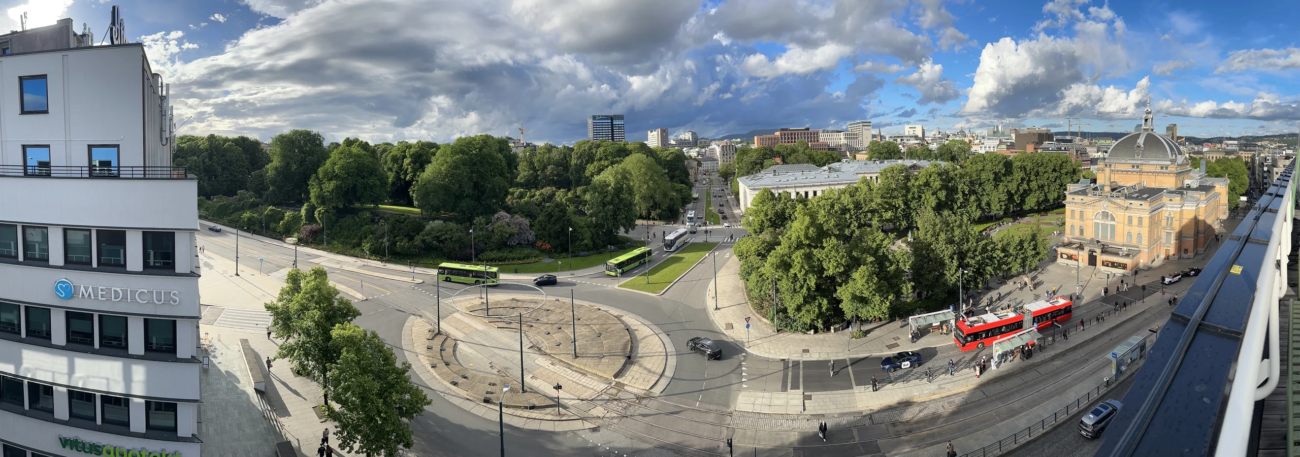 OSLO Norway 2026-06-10 Rooftop cityscape view from Odd Fellow (Stortingsg 28) Munkedamsv. Torstedgården Medicus Slottsparken Abelhaugen Henrik Ibsens g roundabout Frederiks g Nationalth. J Dybwad University bus Distorted panorama IMG