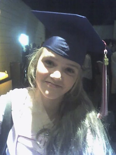 Cassidy in a graduation cap